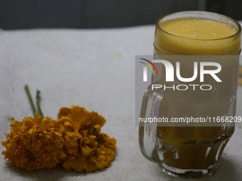 Pulque with Cempasuchil flower petals is viewed in Mexico City, Mexico, on the eve of the Day of the Dead. Pulque is an alcoholic beverage o...