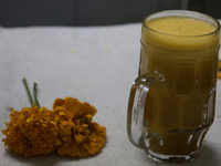 Pulque with Cempasuchil flower petals is viewed in Mexico City, Mexico, on the eve of the Day of the Dead. Pulque is an alcoholic beverage o...