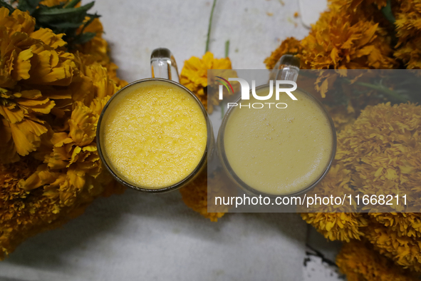 Pulque with Cempasuchil flower petals is viewed in Mexico City, Mexico, on the eve of the Day of the Dead. Pulque is an alcoholic beverage o...