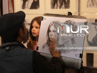 An artist sketches a little girl during the 180th annual Markham Fall Fair in Markham, Ontario, Canada, on October 5, 2024. (