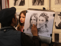 An artist sketches a little girl during the 180th annual Markham Fall Fair in Markham, Ontario, Canada, on October 5, 2024. (