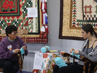 People crochet during the 180th annual Markham Fall Fair in Markham, Ontario, Canada, on October 5, 2024. (