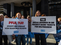 Singer Sarah Connor lies in a mini-aquarium and protests with Peta activists in front of a Tui travel agency for the release of orca whales...