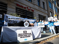 Singer Sarah Connor lies in a mini-aquarium and protests with Peta activists in front of a Tui travel agency for the release of orca whales...