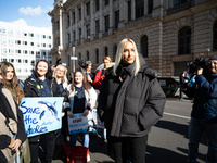 Singer Sarah Connor lies in a mini-aquarium and protests with Peta activists in front of a Tui travel agency for the release of orca whales...