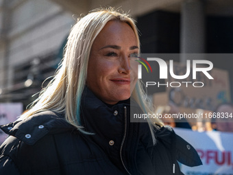 Singer Sarah Connor lies in a mini-aquarium and protests with Peta activists in front of a Tui travel agency for the release of orca whales...