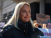 Singer Sarah Connor lies in a mini-aquarium and protests with Peta activists in front of a Tui travel agency for the release of orca whales...