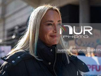 Singer Sarah Connor lies in a mini-aquarium and protests with Peta activists in front of a Tui travel agency for the release of orca whales...