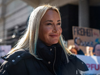 Singer Sarah Connor lies in a mini-aquarium and protests with Peta activists in front of a Tui travel agency for the release of orca whales...