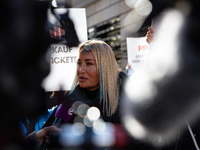 Singer Sarah Connor lies in a mini-aquarium and protests with Peta activists in front of a Tui travel agency for the release of orca whales...