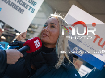 Singer Sarah Connor lies in a mini-aquarium and protests with Peta activists in front of a Tui travel agency for the release of orca whales...