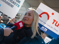 Singer Sarah Connor lies in a mini-aquarium and protests with Peta activists in front of a Tui travel agency for the release of orca whales...