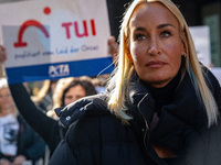 Singer Sarah Connor lies in a mini-aquarium and protests with Peta activists in front of a Tui travel agency for the release of orca whales...