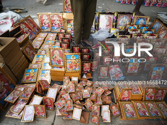 Framed Lakshmi photos are displayed for sale on the eve of the Lakshmi Puja festival in Guwahati, India, on October 15, 2024. Lakshmi is one...