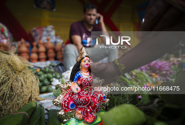 Lakshmi idols are displayed for sale on the eve of the Lakshmi Puja festival in Guwahati, India, on October 15, 2024. Laxmi is one of the mo...