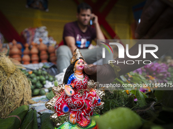 Lakshmi idols are displayed for sale on the eve of the Lakshmi Puja festival in Guwahati, India, on October 15, 2024. Laxmi is one of the mo...