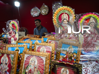 Lakshmi idols are displayed for sale on the eve of the Lakshmi Puja festival in Guwahati, India, on October 15, 2024. Laxmi is one of the mo...