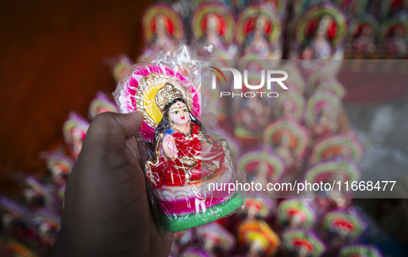 Lakshmi idols are displayed for sale on the eve of the Lakshmi Puja festival in Guwahati, India, on October 15, 2024. Laxmi is one of the mo...