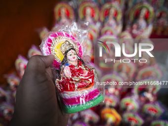 Lakshmi idols are displayed for sale on the eve of the Lakshmi Puja festival in Guwahati, India, on October 15, 2024. Laxmi is one of the mo...