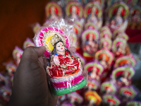 Lakshmi idols are displayed for sale on the eve of the Lakshmi Puja festival in Guwahati, India, on October 15, 2024. Laxmi is one of the mo...