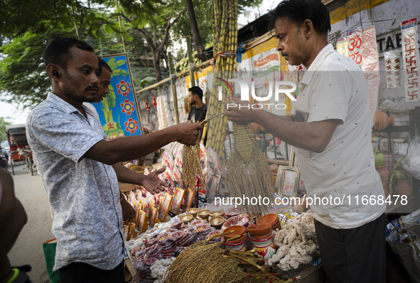 A vendor sells decorative paddy bunches on the eve of the Lakshmi Puja festival in Guwahati, India, on October 15, 2024. Lakshmi is one of t...