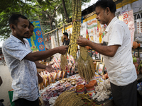 A vendor sells decorative paddy bunches on the eve of the Lakshmi Puja festival in Guwahati, India, on October 15, 2024. Lakshmi is one of t...