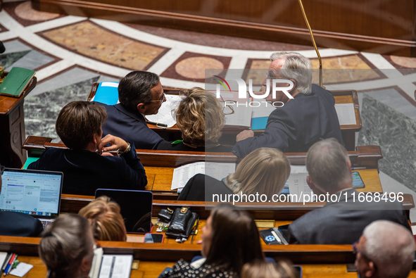 Prime Minister Michel Barnier is at the National Assembly alongside Interior Minister Bruno Retailleau (left) and Nathalie Delattre, Ministe...