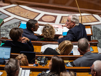 Prime Minister Michel Barnier is at the National Assembly alongside Interior Minister Bruno Retailleau (left) and Nathalie Delattre, Ministe...