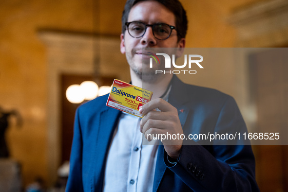 La France Insoumise deputy Hadrien Clouet shows a packet of Doliprane, the best-selling drug in France, at the center of controversy over th...