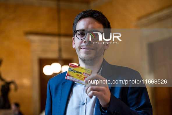 La France Insoumise deputy Hadrien Clouet shows a packet of Doliprane, the best-selling drug in France, at the center of controversy over th...