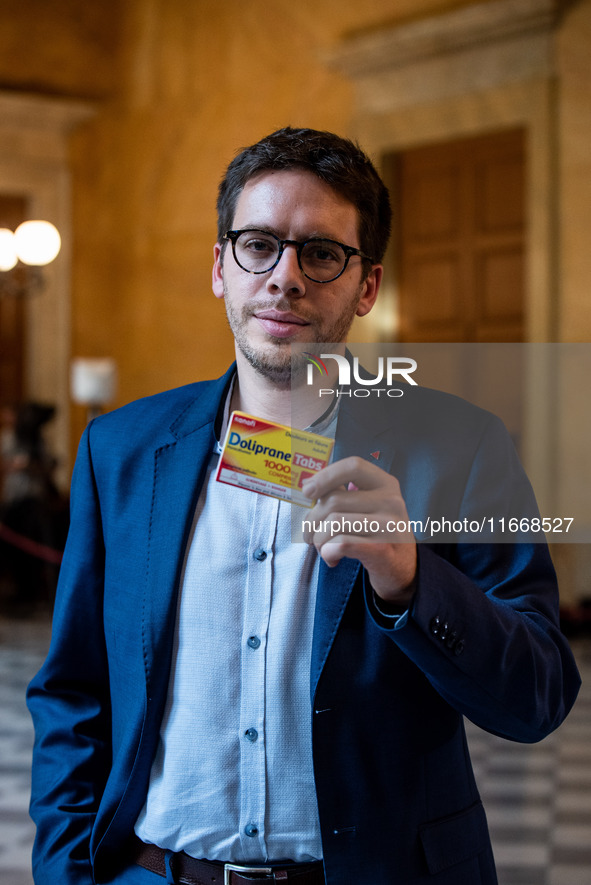 La France Insoumise deputy Hadrien Clouet shows a packet of Doliprane, the best-selling drug in France, at the center of controversy over th...