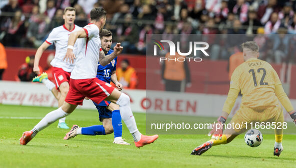 Martin Baturina  scores, Marcin Bulka  during UEFA Nations League match Poland vs Croatia in Warsaw Poland on 15 October 2024. 