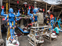 An artist makes final touches to a Hindu Goddess Kali statue for the upcoming Diwali festival at a workshop in Kolkata, India. Diwali is one...