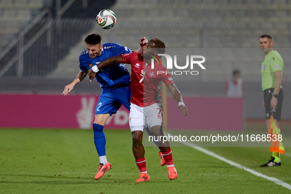 Oleg Reabciuk of Moldova vies for the ball with Joseph Mbong of Malta during the UEFA Nations League, League D, Group D2 soccer match betwee...