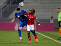 Oleg Reabciuk of Moldova vies for the ball with Joseph Mbong of Malta during the UEFA Nations League, League D, Group D2 soccer match betwee...