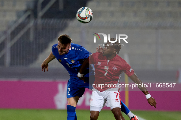 Oleg Reabciuk of Moldova vies for the ball with Joseph Mbong of Malta during the UEFA Nations League, League D, Group D2 soccer match betwee...