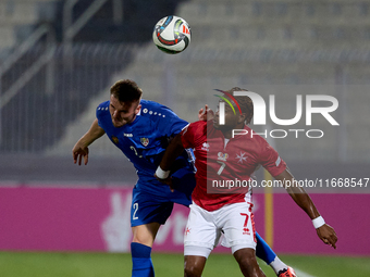 Oleg Reabciuk of Moldova vies for the ball with Joseph Mbong of Malta during the UEFA Nations League, League D, Group D2 soccer match betwee...