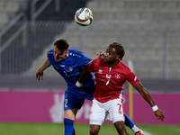 Oleg Reabciuk of Moldova vies for the ball with Joseph Mbong of Malta during the UEFA Nations League, League D, Group D2 soccer match betwee...