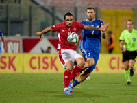 In Ta' Qali, Malta, on October 13, 2024, Kurt Shaw of Malta protects the ball from Artur Ionita of Moldova during the UEFA Nations League, L...