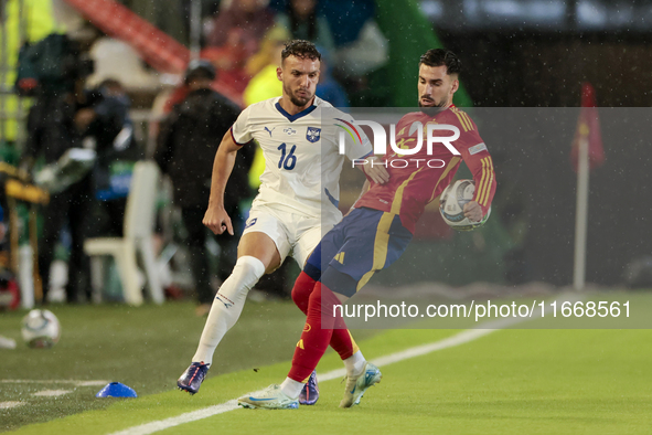 Strahinja Erakovic of Serbia competes for the ball with Alex Baena of Spain during the UEFA Nations League 2024/25 League A Group A4 match b...