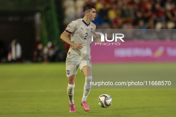 Kosta Nedeljkovic of Serbia runs with the ball during the UEFA Nations League 2024/25 League A Group A4 match between Spain and Serbia at Nu...