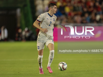 Kosta Nedeljkovic of Serbia runs with the ball during the UEFA Nations League 2024/25 League A Group A4 match between Spain and Serbia at Nu...