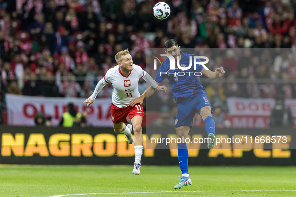 Karol Swiderski , Martin Erlic  during UEFA Nations League match Poland vs Croatia in Warsaw Poland on 15 October 2024. 