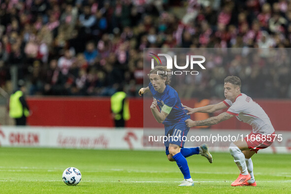 Luka Modric , Kacper Urbanski  during UEFA Nations League match Poland vs Croatia in Warsaw Poland on 15 October 2024. 