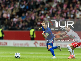 Luka Modric , Kacper Urbanski  during UEFA Nations League match Poland vs Croatia in Warsaw Poland on 15 October 2024. (