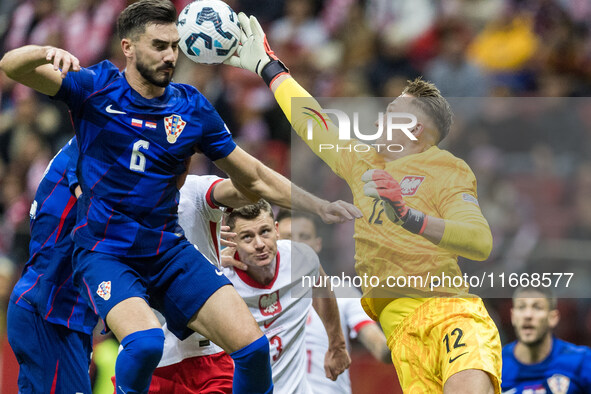 Josip Sutalo , Marcin Bulka  during UEFA Nations League match Poland vs Croatia in Warsaw Poland on 15 October 2024. 