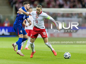 Martin Baturina , Piotr Zielinski  during UEFA Nations League match Poland vs Croatia in Warsaw Poland on 15 October 2024. (