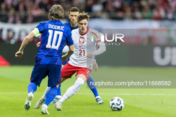 Luka Modric , Nicola Zalewski  during UEFA Nations League match Poland vs Croatia in Warsaw Poland on 15 October 2024. 