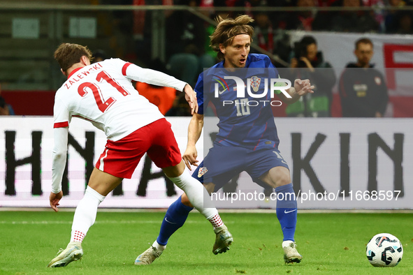 Nicola Zalewski of Poland and Luka Modric of Croatia during UEFA Nations League football match Poland - Croatia at National Stadium in Warsa...