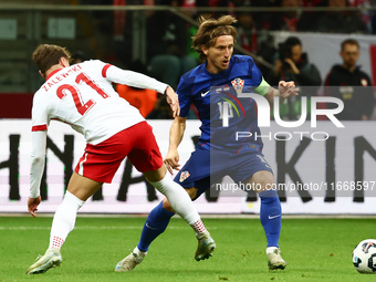 Nicola Zalewski of Poland and Luka Modric of Croatia during UEFA Nations League football match Poland - Croatia at National Stadium in Warsa...